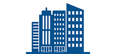 A graphic illustration of a city skyline featuring multiple stylized buildings of varying heights and designs in a solid blue color.